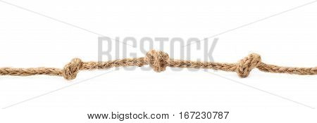 Three knots on a linen rope string isolated over the white background