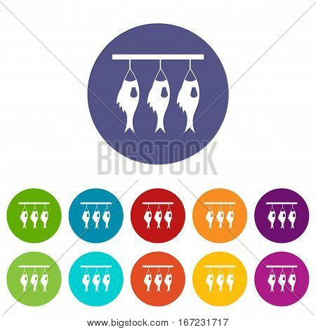 Three dried fish hanging on a rope set icons in different colors isolated on white background