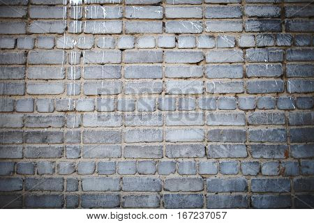 Paint streaks on the brick wall. Constrution concept