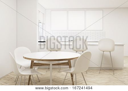Kitchen With Bar, Round Table And Posters