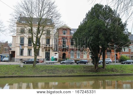 Utrecht the Netherlands - February 13 2016: Old buildings near canal in historic city centre