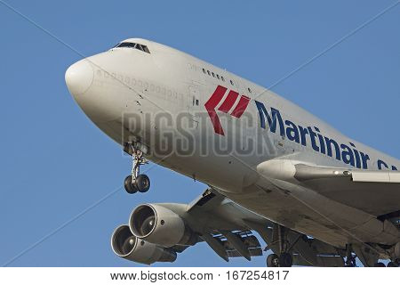 AMSTERDAM, THE NETHERLANDS - SEPTEMBER 12, 2016: Close up photo of a Martinair Boeing 747 cargo airplane just before landing
