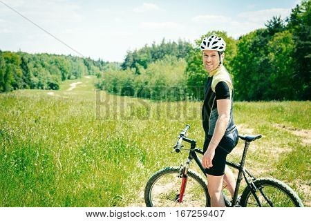 Action shot of a young man riding his mountain bike