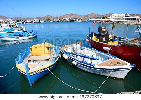 ELOUNDA, CRETE - SEPTEMBER 17, 2016 - Traditional fishing boats in the harbour Elounda Crete Greece Europe, September 17, 2016.