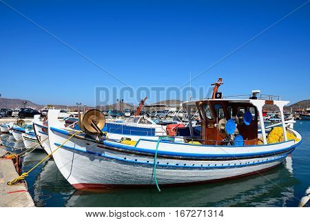 ELOUNDA, CRETE - SEPTEMBER 17, 2016 - Traditional fishing boats in the harbour Elounda Crete Greece Europe, September 17, 2016.