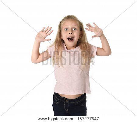 portrait of cute and sweet little girl in disbelief and surprise face expression looking amazed in schock with mouth opened isolated on white background