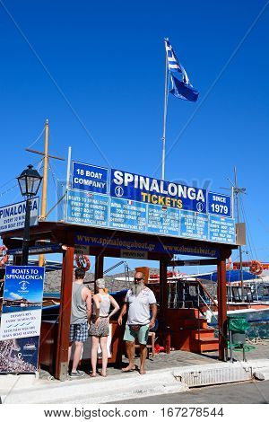 ELOUNDA, CRETE - SEPTEMBER 17, 2016 - Spinalonga trip booking office with boats to the rear Elounda Crete Greece Europe, September 17, 2016.