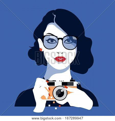 beautiful girl photographed on a vintage camera, isolated on blue background