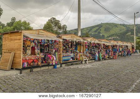 QUITO, ECUADOR, FEBRUARY - 2016 - Indian traditional crafts and clothes market stands located in the famous panecillo landmark in Quito Ecuador.