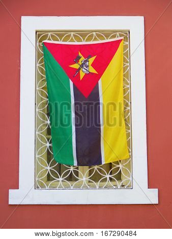 National falg in the window of governmental office in Maputo, Mozambique