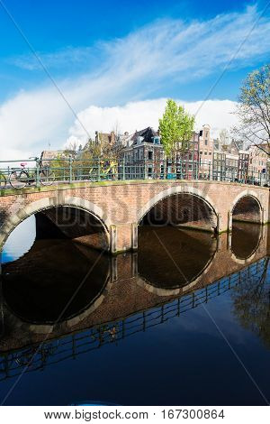 Brisdge over canal with beautiful reflections, Amstardam, Netherlands