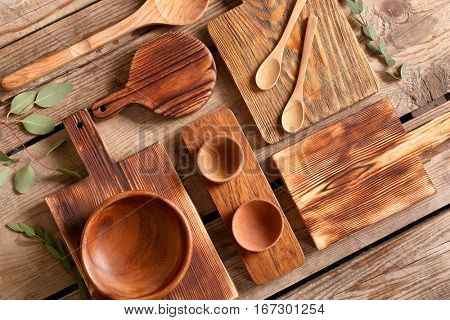 Set of wooden kitchenware on table