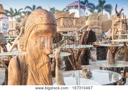 Wooden sculpture face of world famous poet Rabindranath Tagore tables with glass on top handicrafts on display during the Handicraft Fair in Kolkata earlier Calcutta West Bengal India.