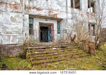 old abandoned high-rise building on gloomy cold autumn day