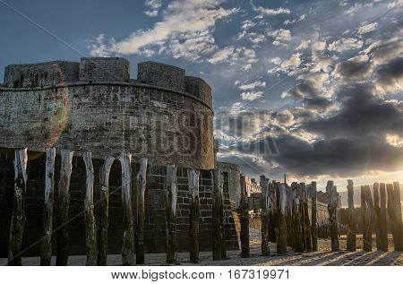 Tower and breakwater on sandy beach in Saint-Malo, Bretagne France