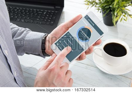 Businessman checks the account balance in mobile application
