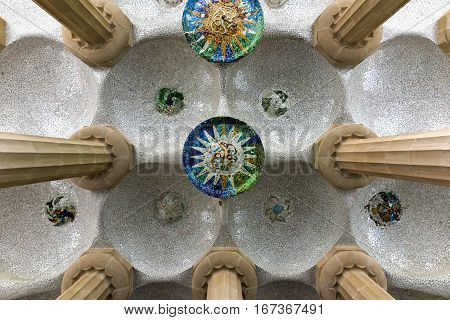 Barcelona, Spain - November 24, 2016: Hypostyle room in Park Guell in Barcelona Spain. It is a public park system composed of gardens and architectonic elements located on Carmel Hill in Barcelona Catalonia (Spain).