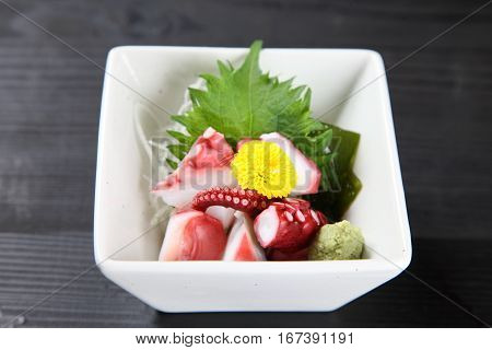 studio shot of boilled octopus with wasabi
