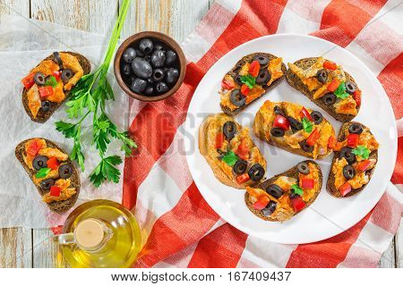 Bruschetta With Pieces Of Fish On White Plate