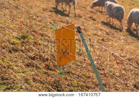 Yellow warning sign Caution Electric wicker fence