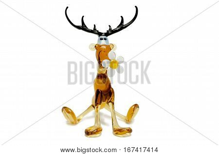 Glass figure Moose Glass with a flower chamomile isolated on a white background.