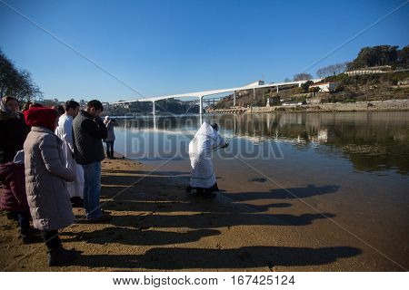 PORTO, PORTUGAL - JAN 19, 2017: Celebrating Baptism of Jesus in the Parish of Russian Orthodox Church near Douro river. This is one of the holiest holidays for all Christians. 