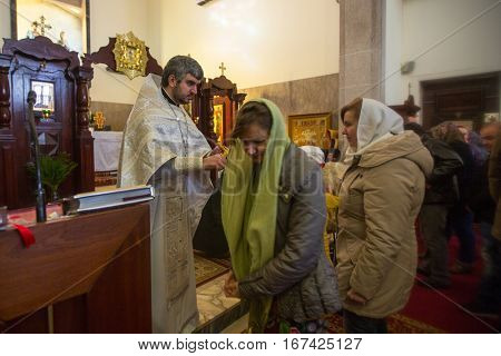 PORTO, PORTUGAL - JAN 19, 2017: During celebrating Baptism of Jesus in the Parish of Russian Orthodox Church. This is one of the holiest holidays for all Christians.