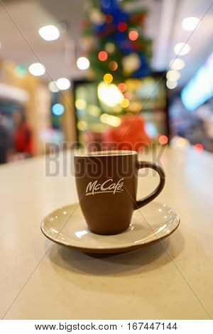 SHENZHEN, CHINA - CIRCA DECEMBER, 2016: cup with logo of McCafe. McCafe is a coffee-house-style food and drink chain, owned by McDonald's.