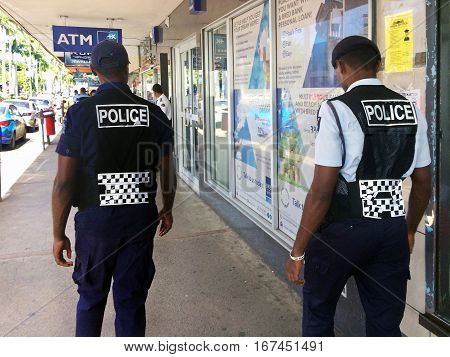 Fijian Police Officers Patrolling In The Main Street
