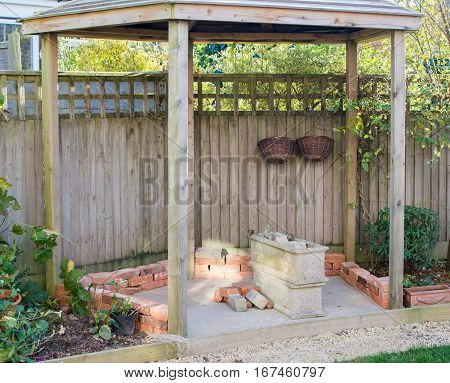 DIY project: planning gazebo in the garden rows of bricks selective focus