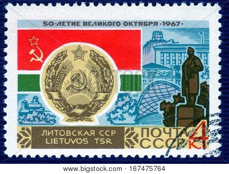 USSR - CIRCA 1967: post stamp printed in the USSR shows Coat of Arms, Flag and monument Lithuanian SSR, serie 
