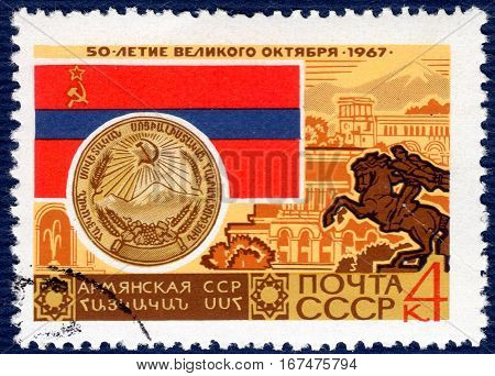USSR - CIRCA 1967: post stamp printed in the USSR shows Coat of Arms, Flag and monument Armenian SSR, serie 