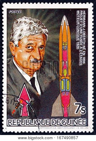 GUINEA - CIRCA 1985: a stamp printed in Guinea shows Scientist Hermann J. Oberth German Physicist and Engineer and Two-stage Rocket circa 1985