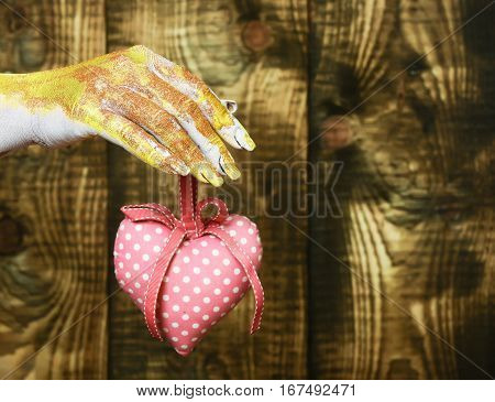 Female Hand Holding Valentine Heart