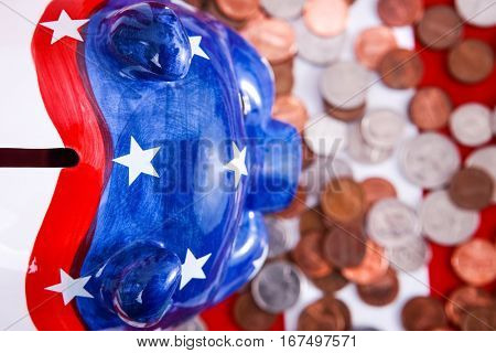 American piggy bank from above with coins, focus on ears