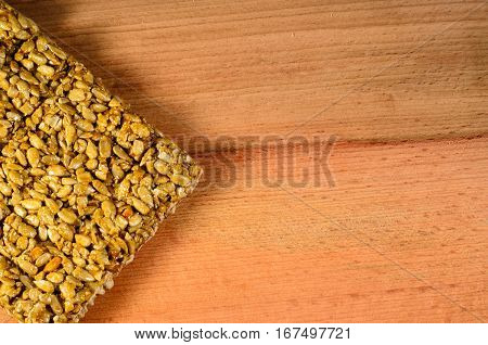 Brittles with sunflower seeds on a wooden table. Top view