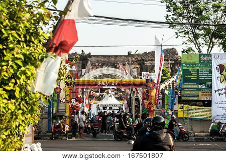 Yogyakarta, Indonesia - September 2, 2015: Busy street scene in front of entrance to Taman Sari area where festivities are going on