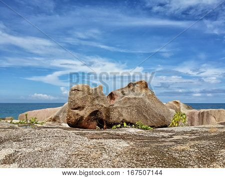 Stones against the sea and sky with clouds. Koh Samui Thailand