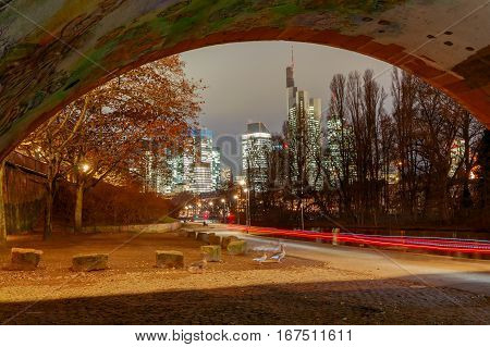 Picturesque views of the city's waterfront and skyscrapers at night in Frankfurt. Germany.