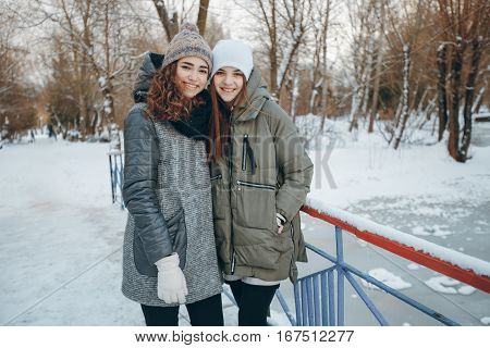 Girl walking in winter park and talking