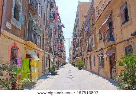 Barcelona, Spain-july 23: Narrow Street In Barceloneta Of Barcelona On July 23,2012 People Go To The