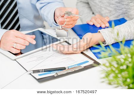 loan agent home key real estate realtor house keychain signature banking meeting - stock image