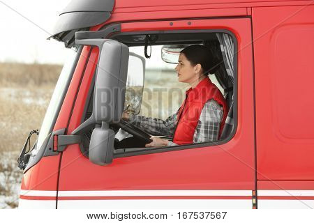 Young woman driving big modern truck
