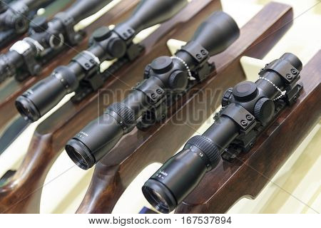 Stand with hunting rifles with telescopic sights. Weapon