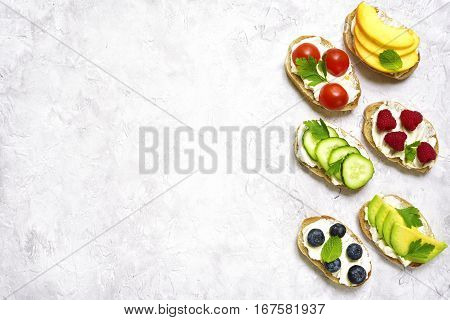 Assortment Of Fruit And Vegetable Toasts.top View With Space For Text.