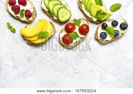 Assortment Of Fruit And Vegetable Toasts.top View With Space For Text.