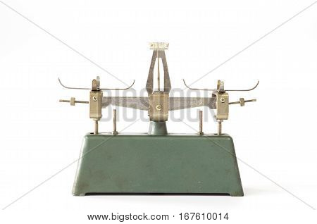 Old vintage metal antique balance scale on white background