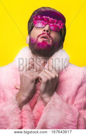 Man In A Pink Fur Coat And Carnival Glasses