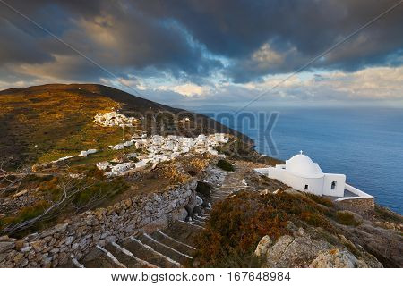 Church over village of Kastro on Sikinos island early in the morning.