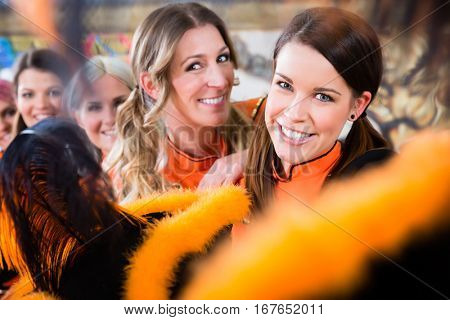 Young women as germen red Funken folklore dance group in fasching carnival